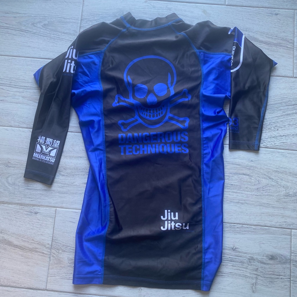93 BrandMeerkatsu Jiu Jitsu Blue Belt Ranked Rash Guard